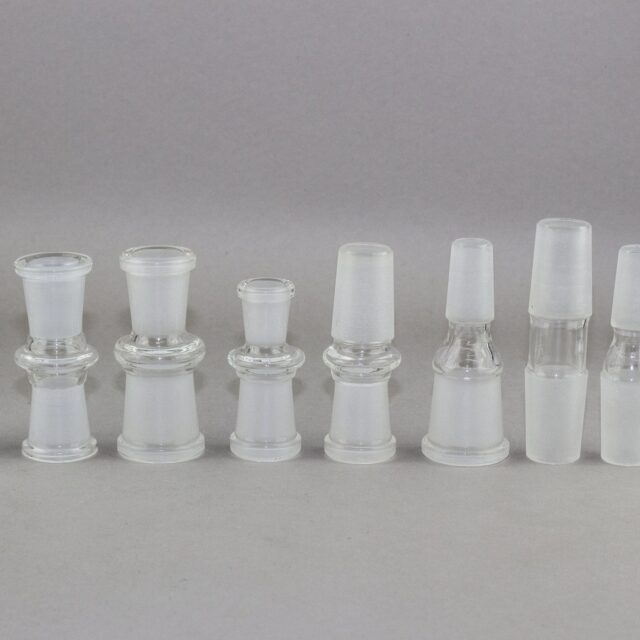 Alien Flower Monkey Bong Adapters in Assorted Sizes Lined Up