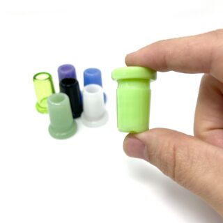 Hand Holding Alien Flower Monkey Slyme Reducer 18F to 14F With other Assorted Colours Visible in the background