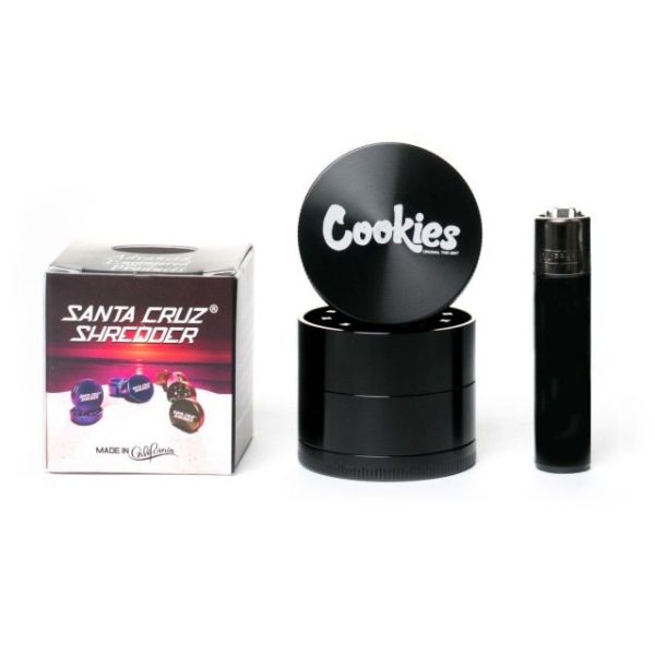 Santa Cruz Shredder x Cookies 4-Piece Medium Shredder in Black with Clipper lighter to show scale