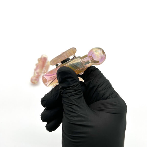 Hand holding Praxis Glass One Hitter Voyager 2.0 pipe With Handle